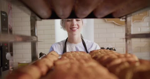 The Art of Baking: Talented Female Kitchen Staff Creates Culinary Masterpieces Stock Footage 243453631