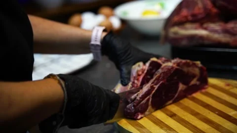 The Art of Butchery: Capturing the Precision and Skill of Meat Cutting Stock Footage 236569975
