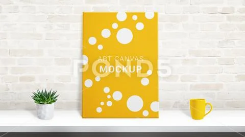 Art canvas mockup on desk leaning against the brick wall PSD Template