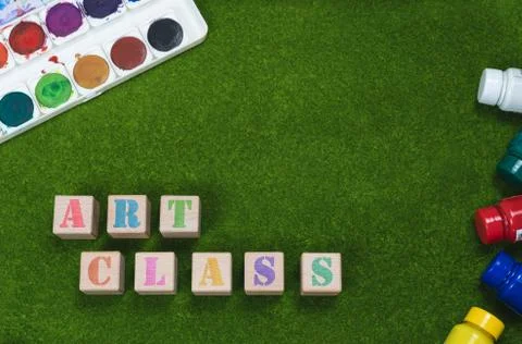 Art class flat lay concept written on wood blocks on grass background - Creative Stock Photos