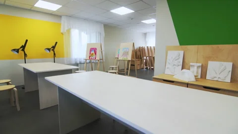 Art classroom featuring bold color touches to encourage creativity 動画素材 295273125