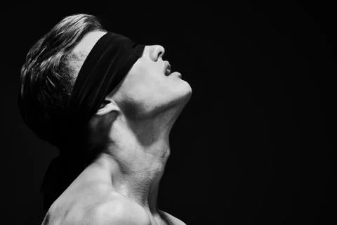 Art close up portrait of a handsome athletic young blindfold man body. Men's  Stock Photos