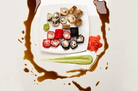 Art composition of assorted rolls, ginger, wasabi and soy sauce Stock Photos