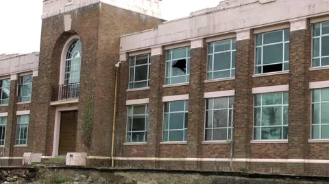Art deco factory broken windows derelict urban decay Stock Footage 47452230