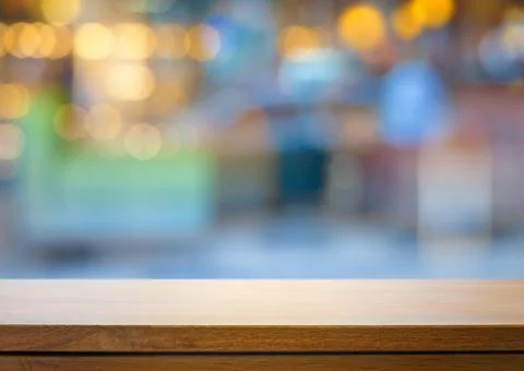 Art Empty wooden deck table over blurred fashion boutique background. Stock Photos