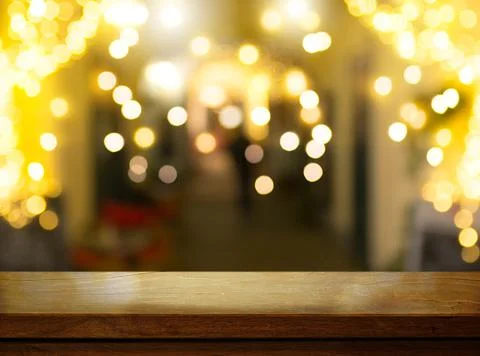 Art Empty wooden table on the background of lights of the Christmas holidays Stock Photos