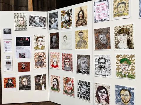 Art exhibition wall of painted and drawn portraits displayed in a pop up ga.. Stock Photos