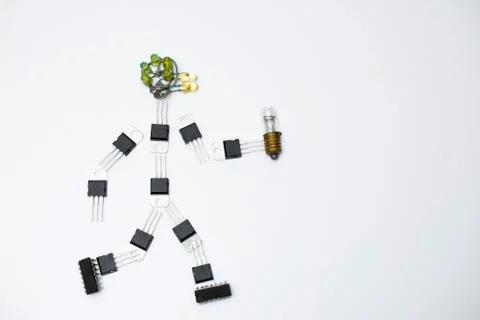 Art figure made of micro chips walking on white background Stock Photos
