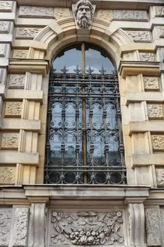 Art forged grating on the window. 库存照片