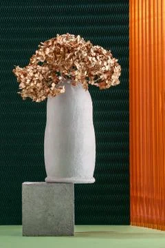 Art installation using elements of concrete, dried flowers and non-traditiona Stock Photos
