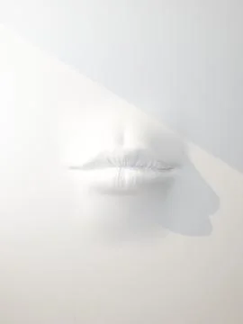 Art lips in white wall front view Stock Illustration