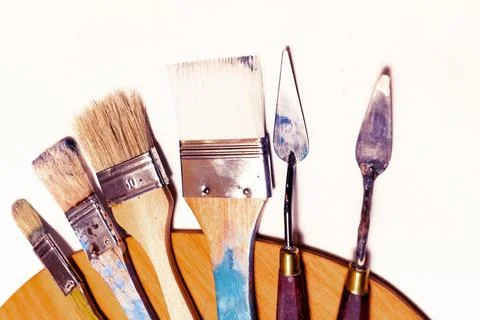 Art materials such as brushes of different sizes Stock Photos
