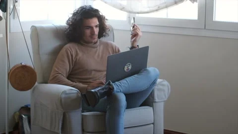 The Art of Multitasking: A Caucasian Man's Work-From-Home Routine Stock Footage 235364353
