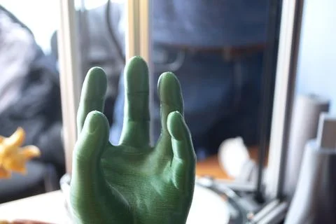 Art objects human hand printed 3D printer. Interior model created on 3D printer Stock Photos