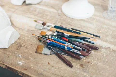 Art paint brushes on the table. Stock Photos