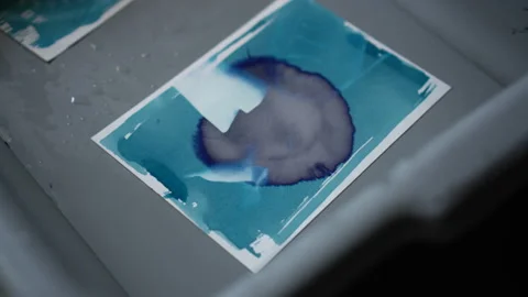 Art printing process adding ferric iodide to cyanotype mixture make blue colo Vídeos de archivo 153531074