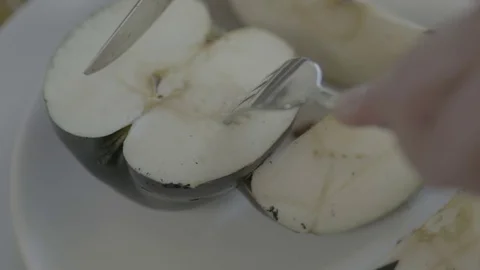Art scene eating black apple Stock Footage 71782666