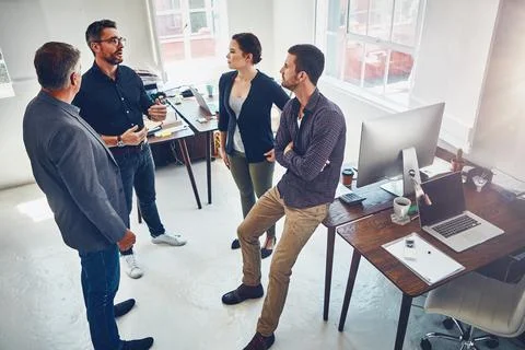 The art of solving creative problems requires thinkers. a group of designers Stock Photos