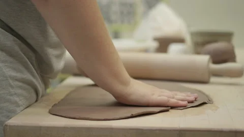 Art student rolling clay Stock Footage 134197871