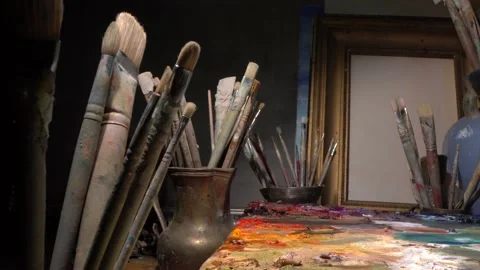 Art studio interior with tools for painting - Brushes, oil paints, palette Stock Footage 142686065