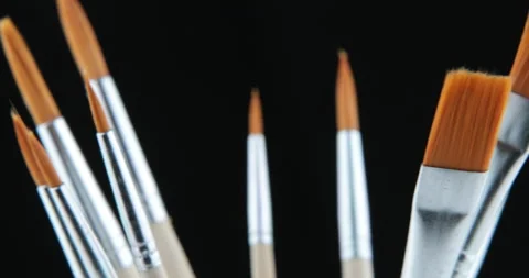 Art studio paint brushes and ink paintings 스톡 동영상 107446591
