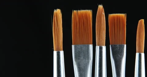 Art studio paint brushes and ink paintings Stock Footage 107446835