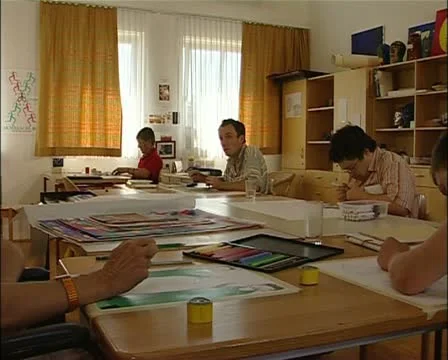 Art workshop for mentally handicapped artists with teacher Stock Footage 21736631