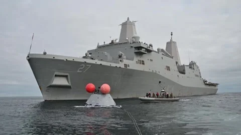 Artemis I Orion spacecraft floating beside U.S. Navy dock ship USS Portland  Stock Footage 271541996