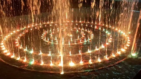 Artesian fountain with various colored lights in Romania. 4K video Stock Footage 317429906