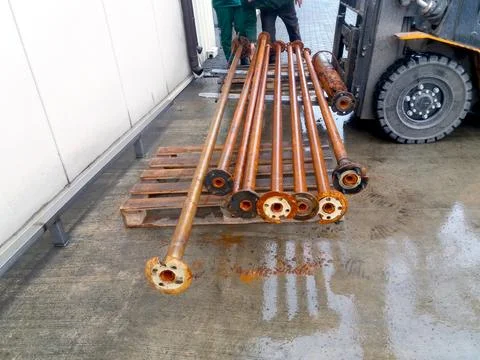 Artesian Well Pipes Being Prepared for Installation at a Construction Site .. Stock Photos
