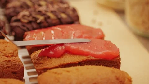 Artezan bread with red strawberry jam on top, fresh bake double chocolate banana Stock Footage 271661496
