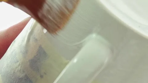 Artful Hands Transforming a Plain Mug With Craft Magic Stock Footage 340594197