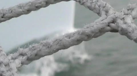 Artful shot shallow depth of field looking through catamaran trampoline Stock Footage 67959553