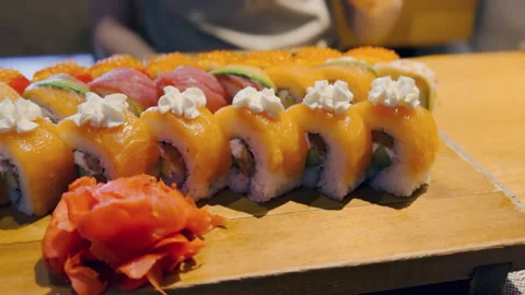 Artfully crafted sushi rolls on an elegant wooden platter Stock Footage 280833351