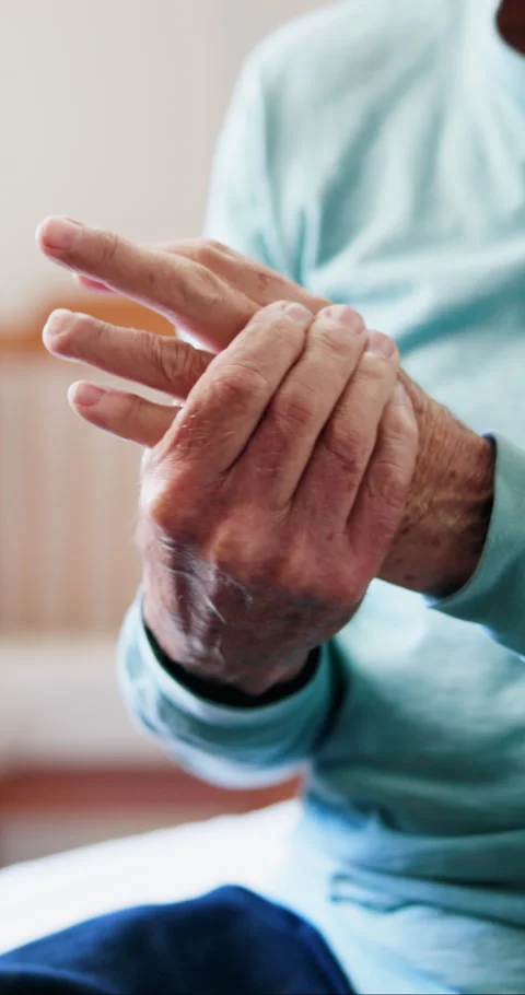 Arthritis, hands or old man in house with massage, joint pain or stiffness in Stock Footage 333189225