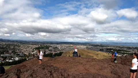 Arthurs Seat viewpoint with people overlooking Edinburgh Stock Footage 346355360