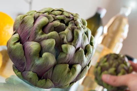 Artichoke on the table Stock Photos