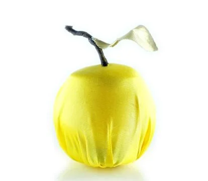 Artificial apple on a white background Stock Photos