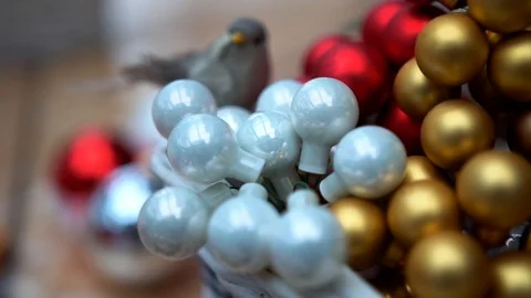 Artificial bird on small multicolor glass christmas tree balls, close-up Stock-Footage 89240378