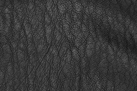 Artificial black leather texture closeup. The solid patterned background Foto stock