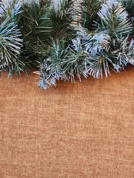 Artificial Christmas tree branches on rough fabric. Artificial tree Foto stock