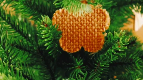 Artificial christmas tree with christmas decorations made of natural materials. Stock Footage 221150685