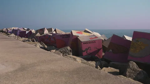 Artificial cliff barrier on the Acciaroli's harbor on the Mediterranean Sea Video stock 279117894