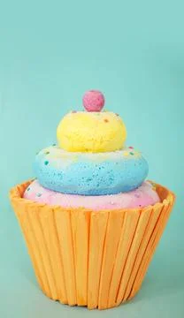 Artificial cupcake made from polystyrene foam with colorful layers of blue Stock Photos