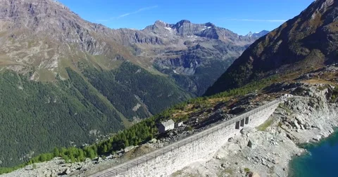 Artificial dam - The dam wall - Aerial view 4k Stock Footage 68093128