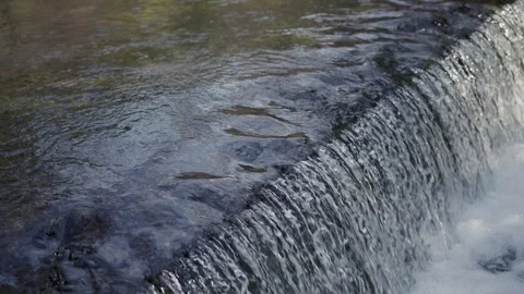 An artificial dam with a waterfall Vídeo Stock 341898481