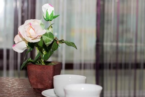 Artificial decorative flower on the tea table Stock Photos