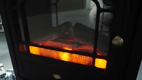 Artificial fireplace with imitation of burning logs Stock Footage 136891403