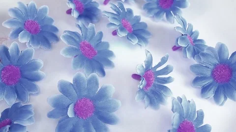 Artificial flowers on rotating plate seamless looping hd background cover video Stock Footage 107615563