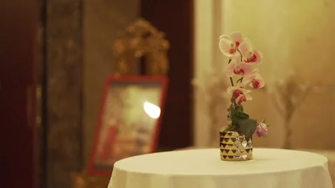 Artificial flowers on a round table Stock Footage 247359652